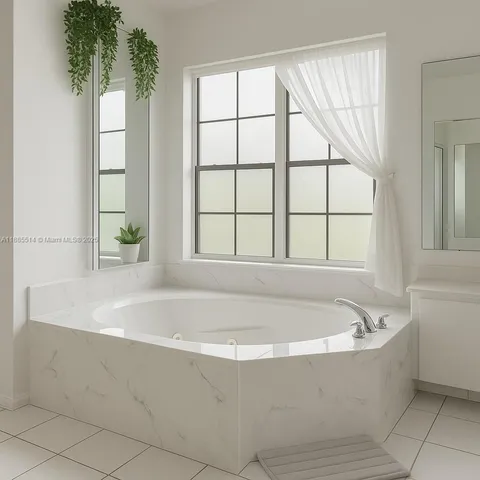 a white bath tub sitting in a bathroom next to a window