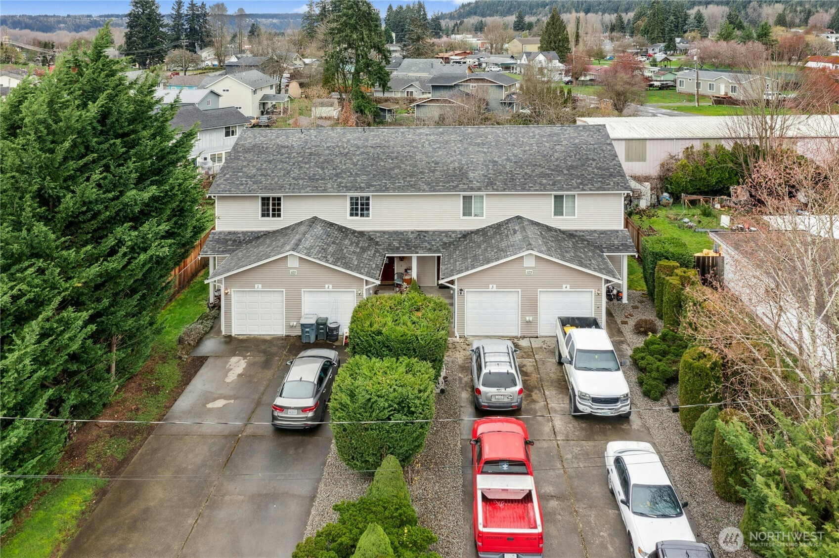 103 Harrison Lane, Unit 14 Orting, WA 98360 - Photo 1 of 17 an aerial view of a house with garden space and street view