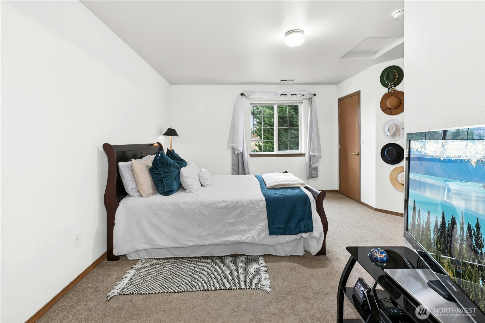 103 Harrison Lane, Unit 14 Orting, WA 98360 - Photo 12 of 17 a bedroom with a bed and window