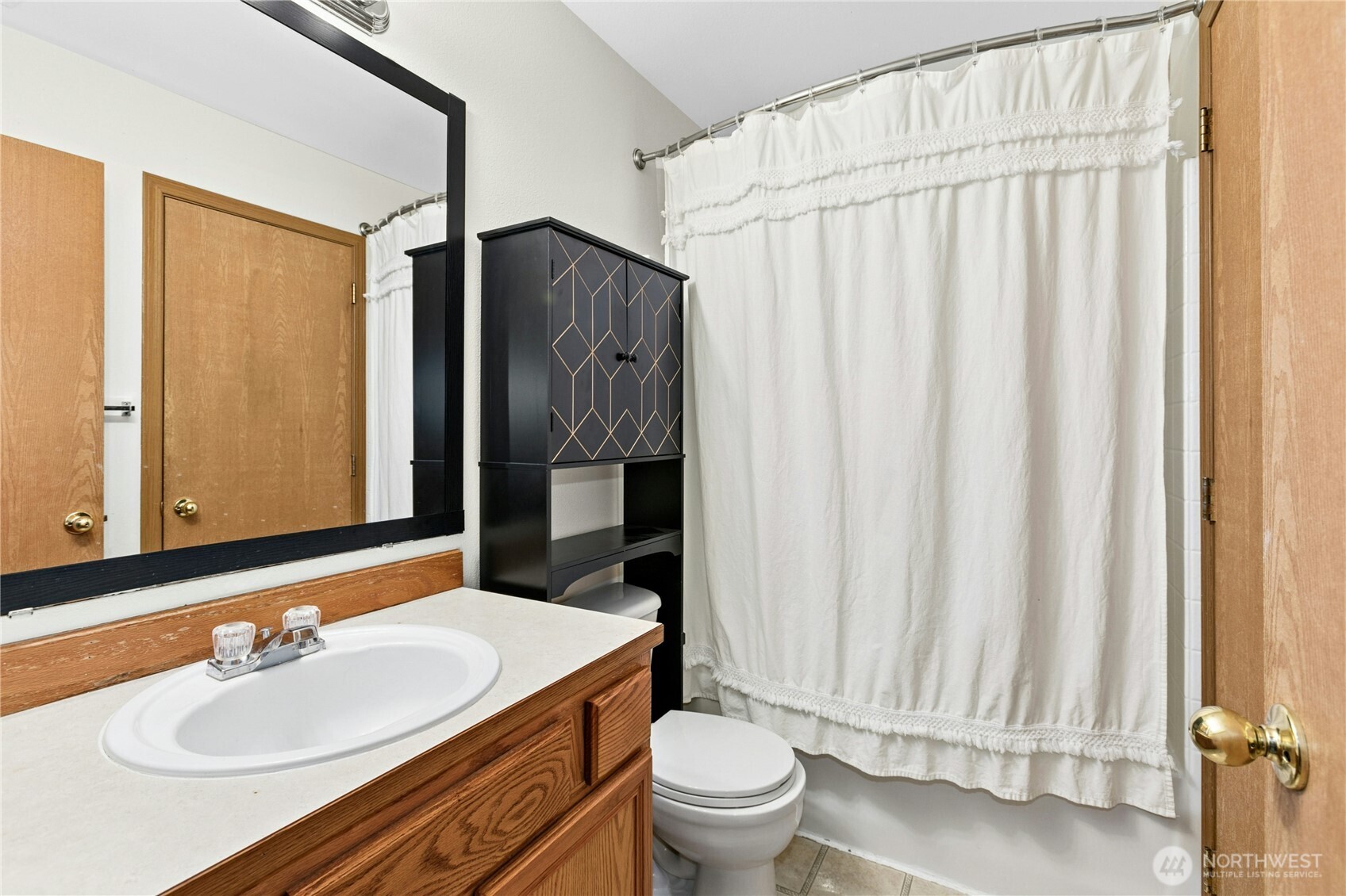 103 Harrison Lane, Unit 14 Orting, WA 98360 - Photo 13 of 17 a bathroom with a sink toilet and shower