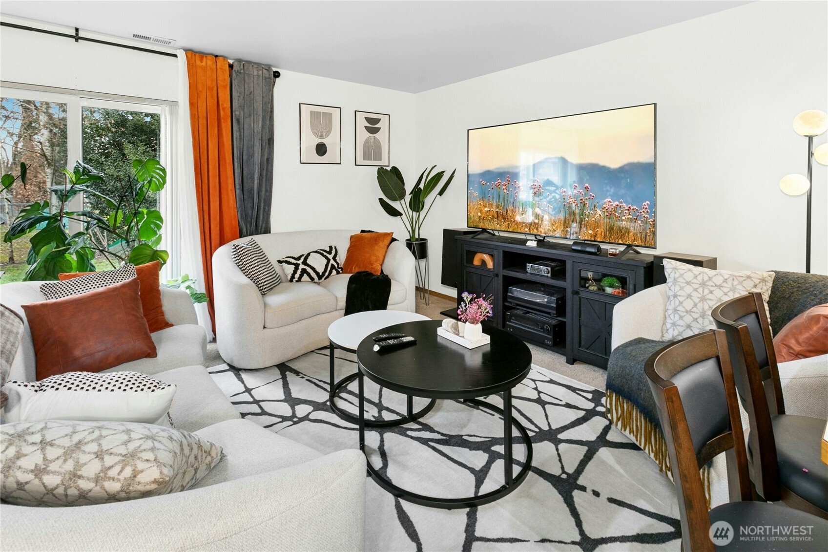 103 Harrison Lane, Unit 14 Orting, WA 98360 - Photo 5 of 17 a living room with furniture and a flat screen tv