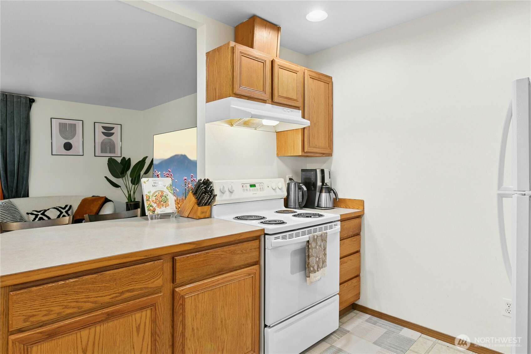 103 Harrison Lane, Unit 14 Orting, WA 98360 - Photo 8 of 17 a kitchen with a sink cabinets and appliances