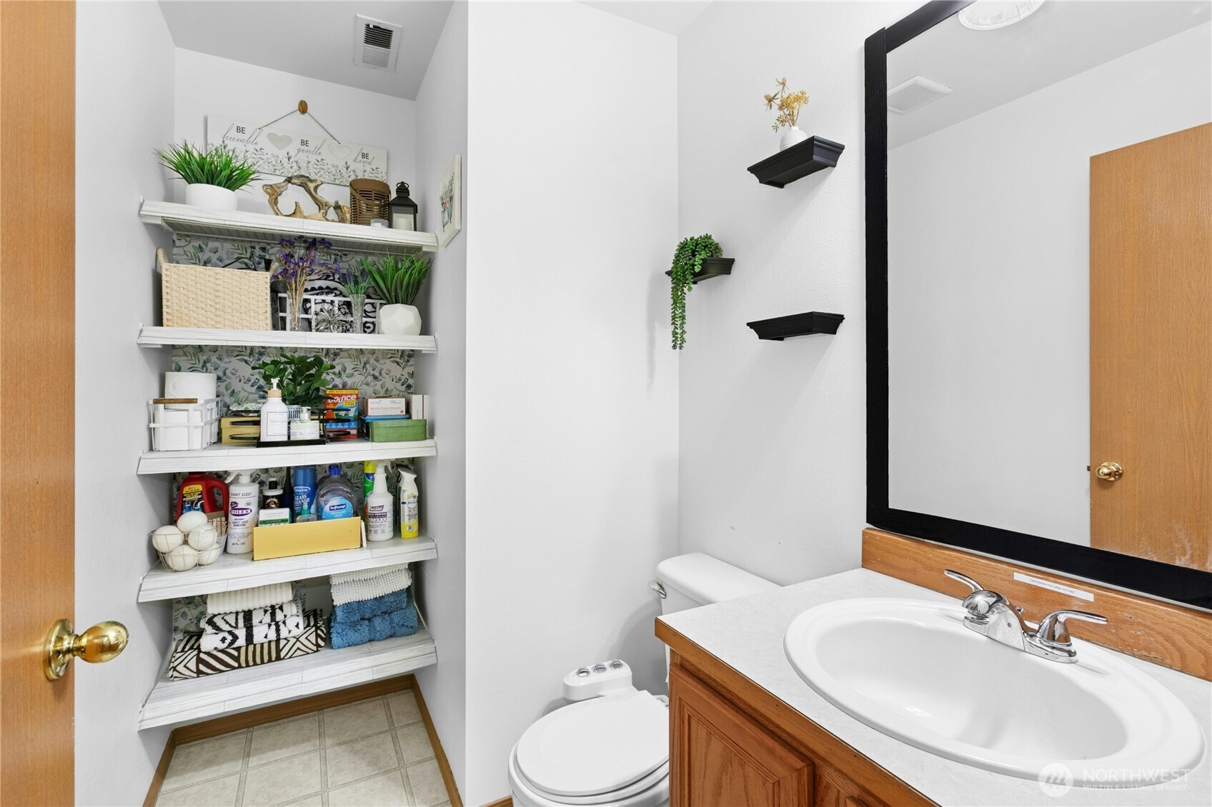 103 Harrison Lane, Unit 14 Orting, WA 98360 - Photo 9 of 17 a bathroom with a sink a toilet and a shower curtain