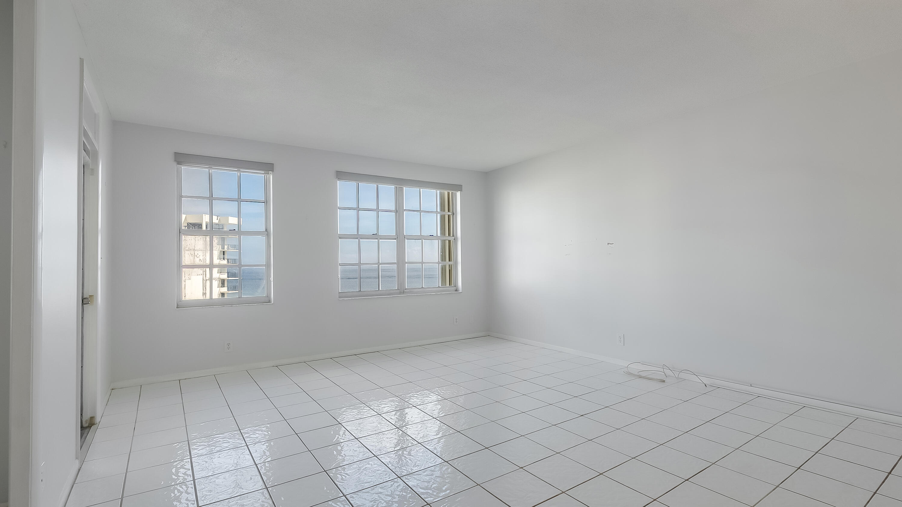 3475 South Ocean Boulevard, Unit 5140 Palm Beach, FL 33480 - Photo 13 of 55 an empty room with windows