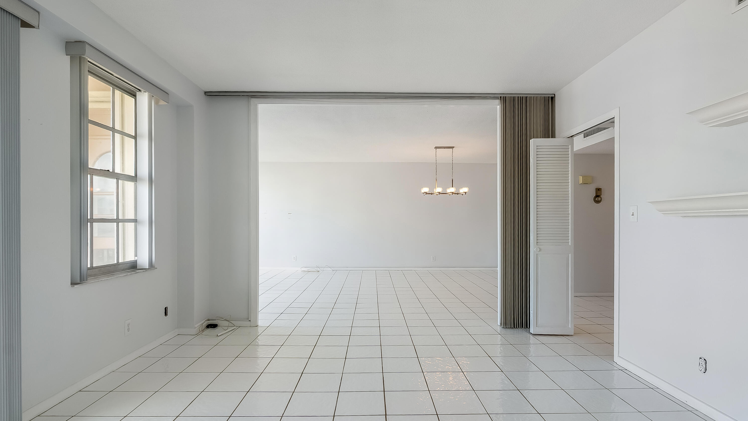 3475 South Ocean Boulevard, Unit 5140 Palm Beach, FL 33480 - Photo 26 of 55 a view of an empty room with window and cabinet area