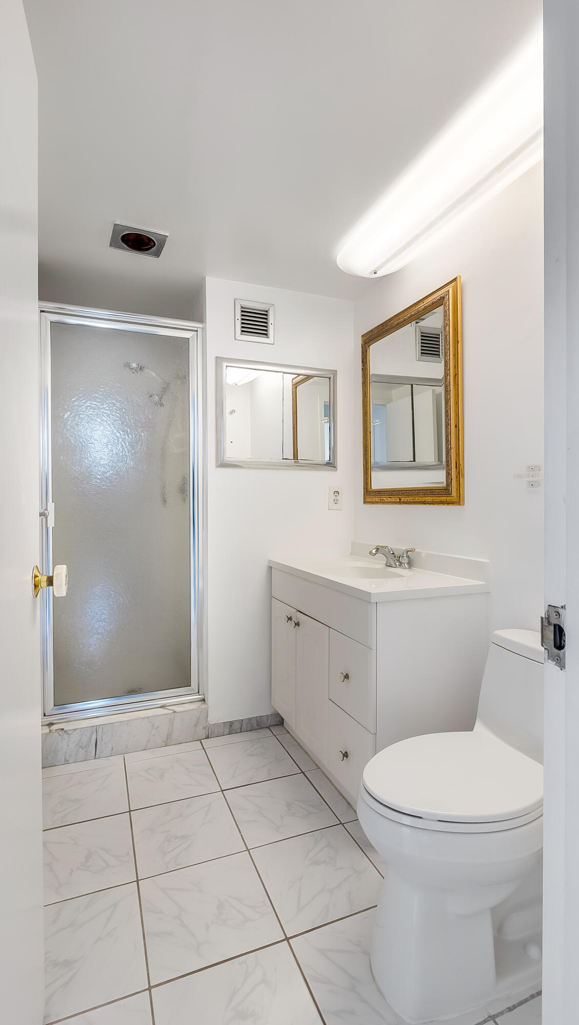 3475 South Ocean Boulevard, Unit 5140 Palm Beach, FL 33480 - Photo 30 of 55 a bathroom with a toilet sink and mirror