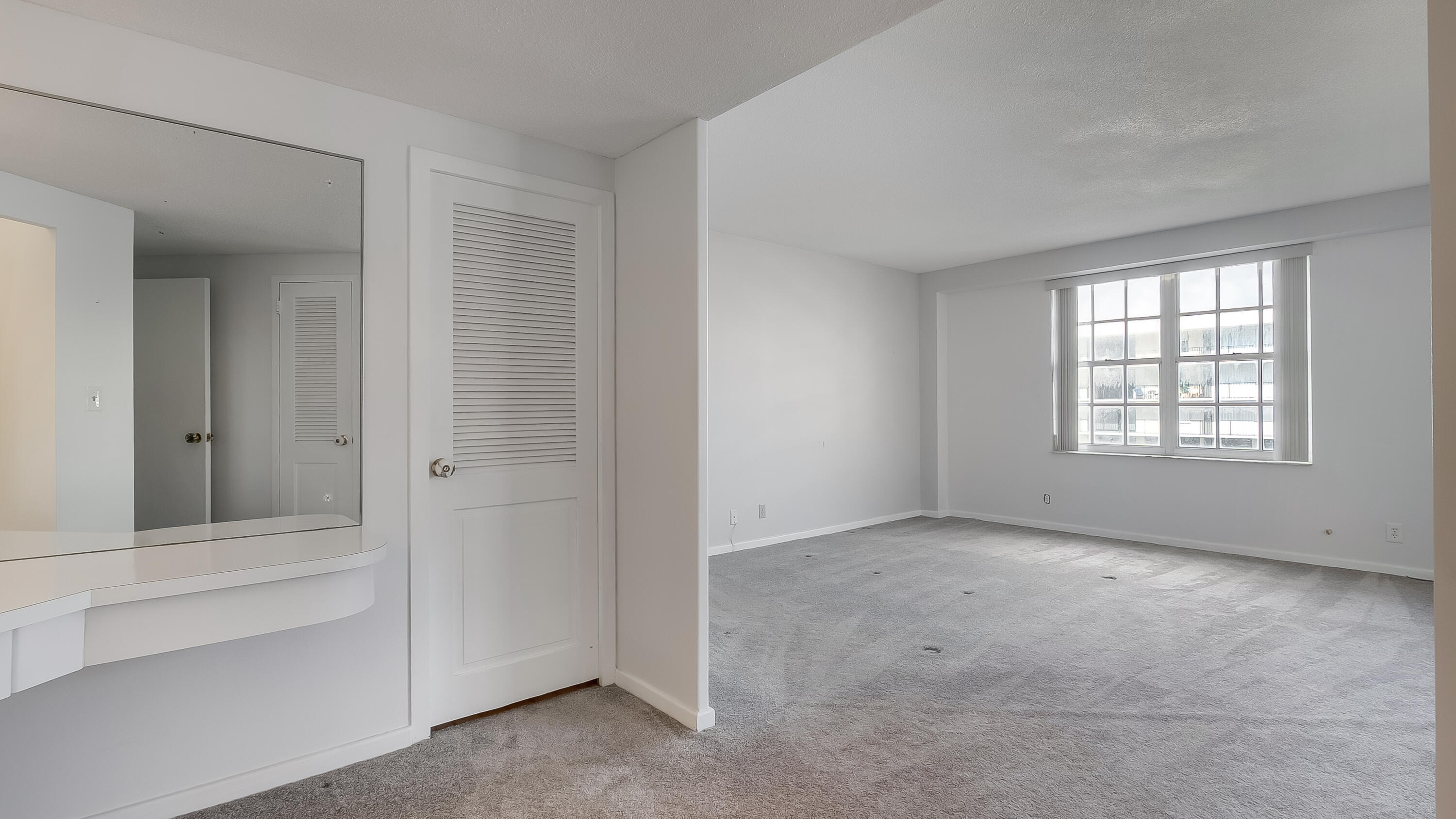 3475 South Ocean Boulevard, Unit 5140 Palm Beach, FL 33480 - Photo 31 of 55 an empty room with windows