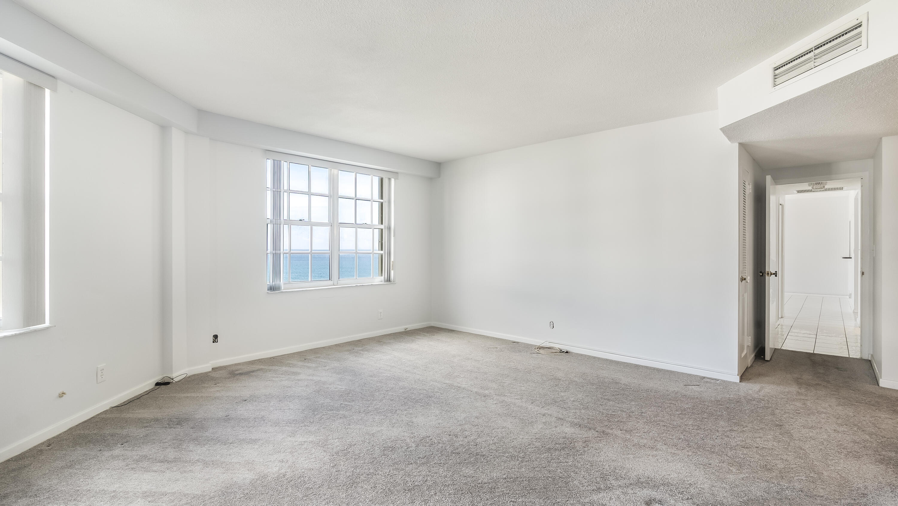 3475 South Ocean Boulevard, Unit 5140 Palm Beach, FL 33480 - Photo 34 of 55 an empty room with windows