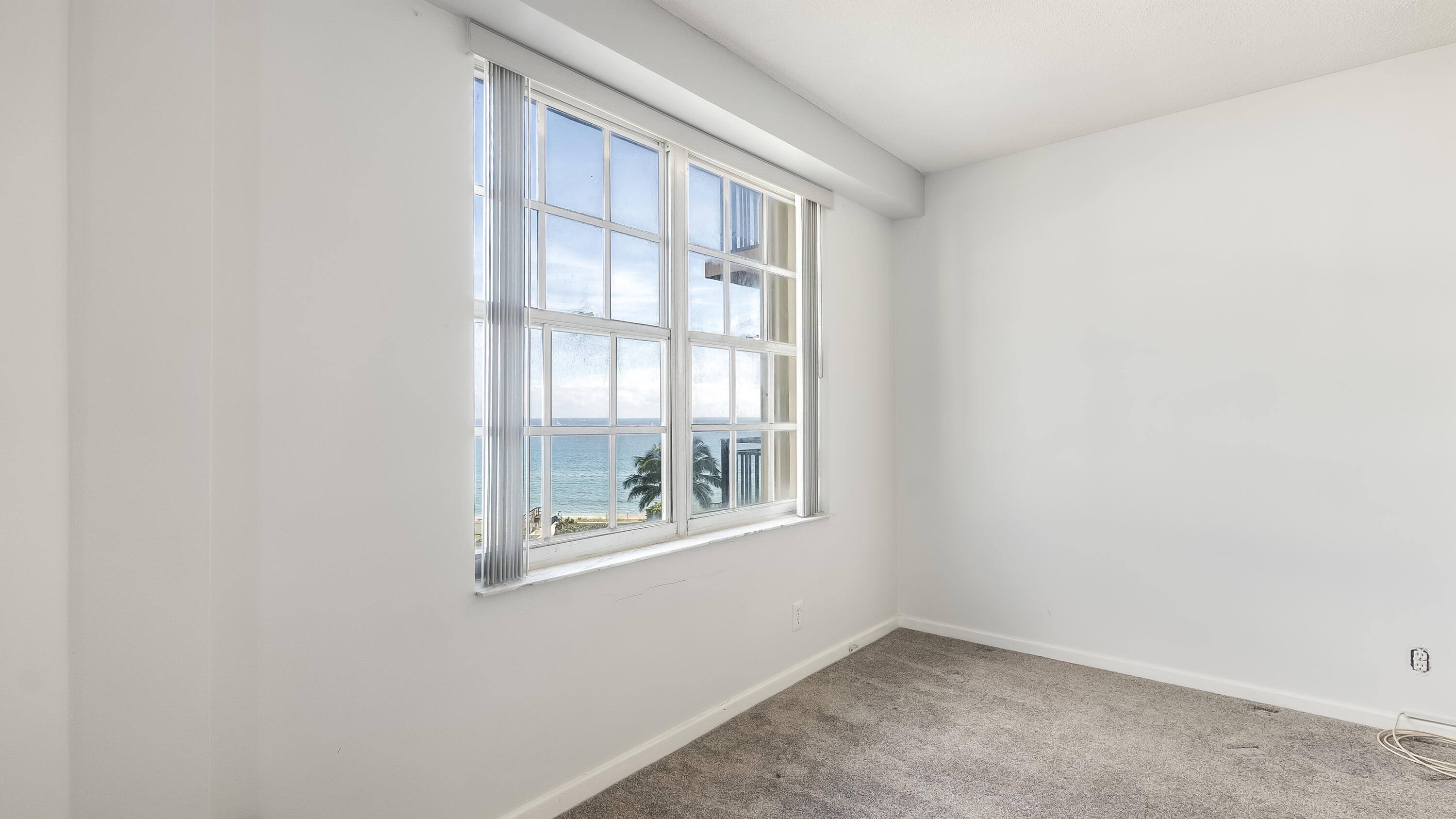 3475 South Ocean Boulevard, Unit 5140 Palm Beach, FL 33480 - Photo 36 of 55 an empty room with a window