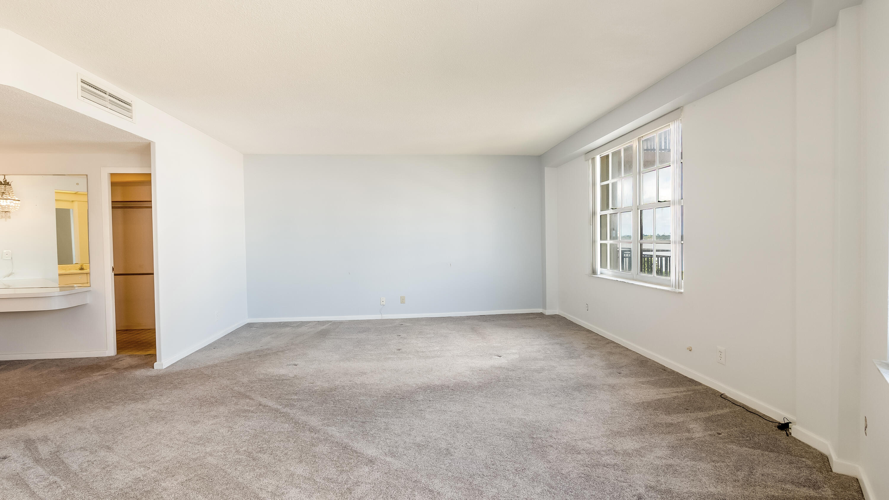 3475 South Ocean Boulevard, Unit 5140 Palm Beach, FL 33480 - Photo 38 of 55 an empty room with windows