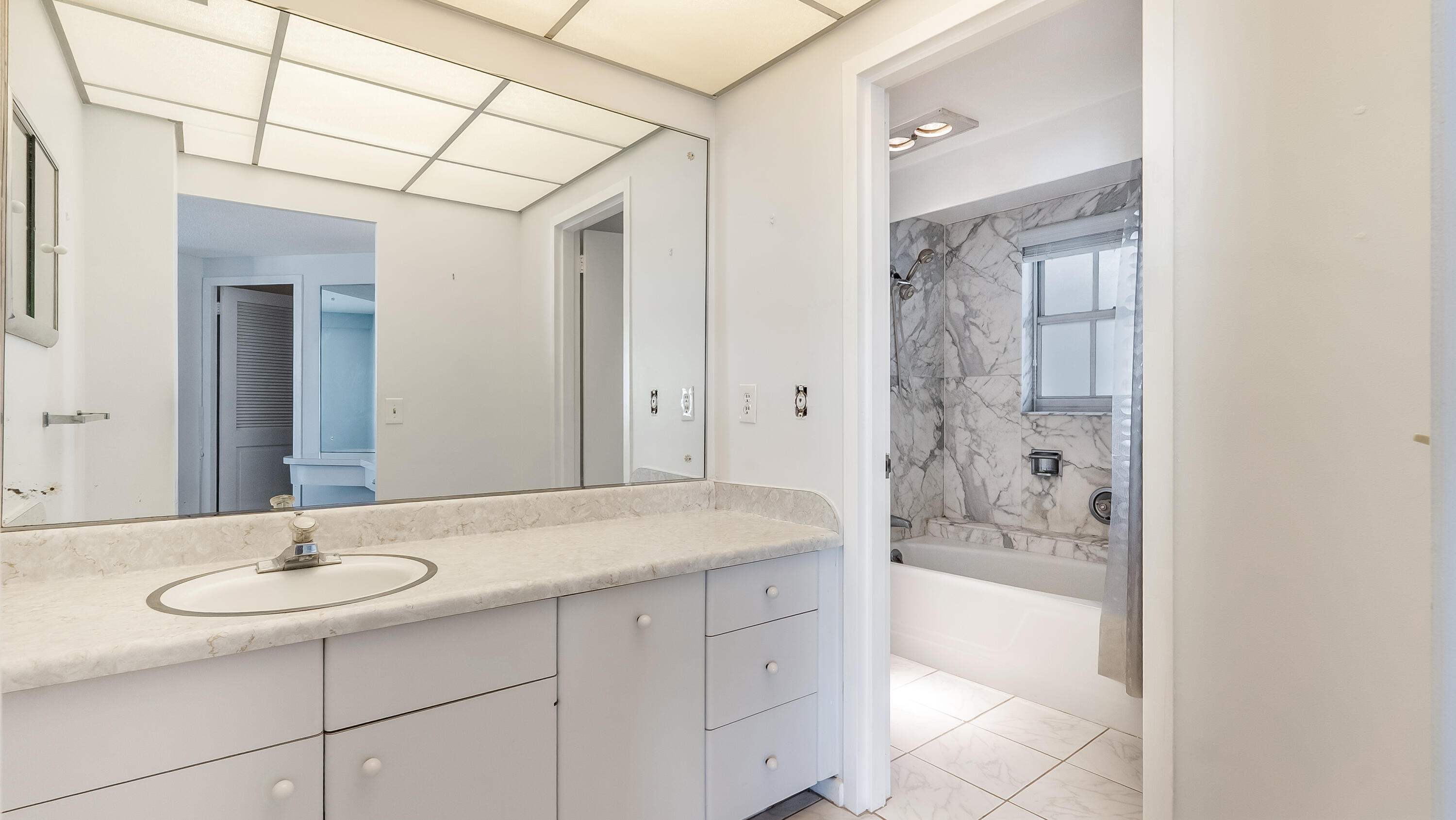 3475 South Ocean Boulevard, Unit 5140 Palm Beach, FL 33480 - Photo 41 of 55 a bathroom with a sink and a mirror