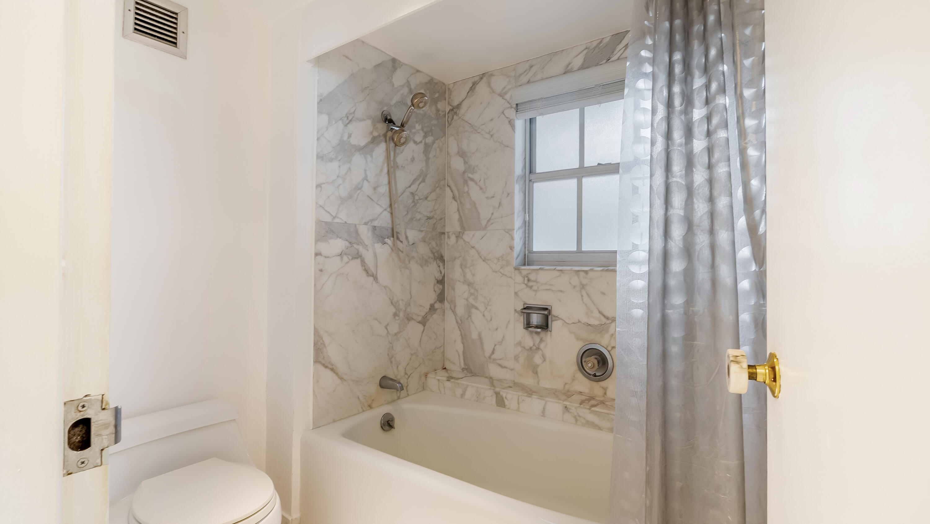 3475 South Ocean Boulevard, Unit 5140 Palm Beach, FL 33480 - Photo 42 of 55 a bathroom with a shower curtain