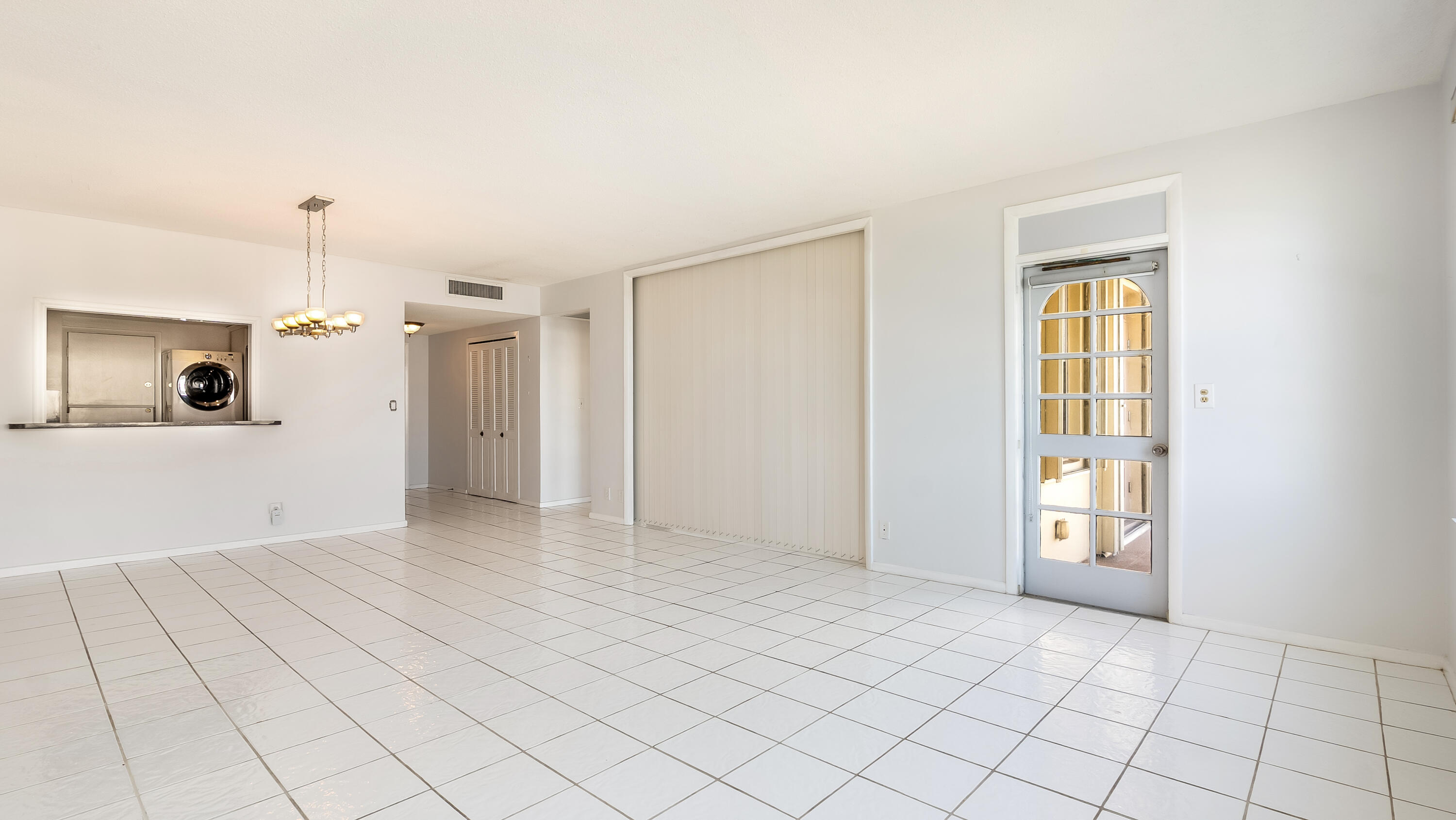 3475 South Ocean Boulevard, Unit 5140 Palm Beach, FL 33480 - Photo 47 of 55 a view of an empty room with window and cabinet area