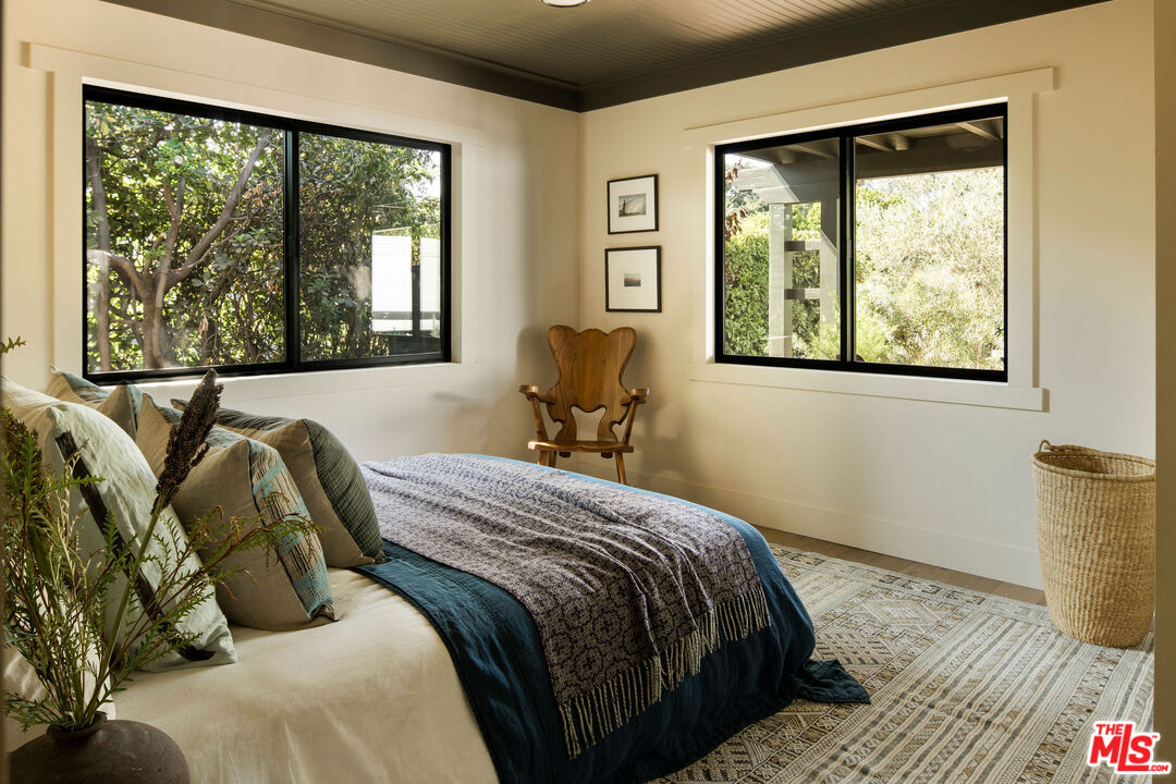 274 Acacia Street Altadena, CA 91001 - Photo 11 of 18 a bedroom with a bed and wooden floor