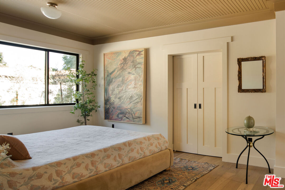 274 Acacia Street Altadena, CA 91001 - Photo 13 of 18 a bedroom with a bed and a window