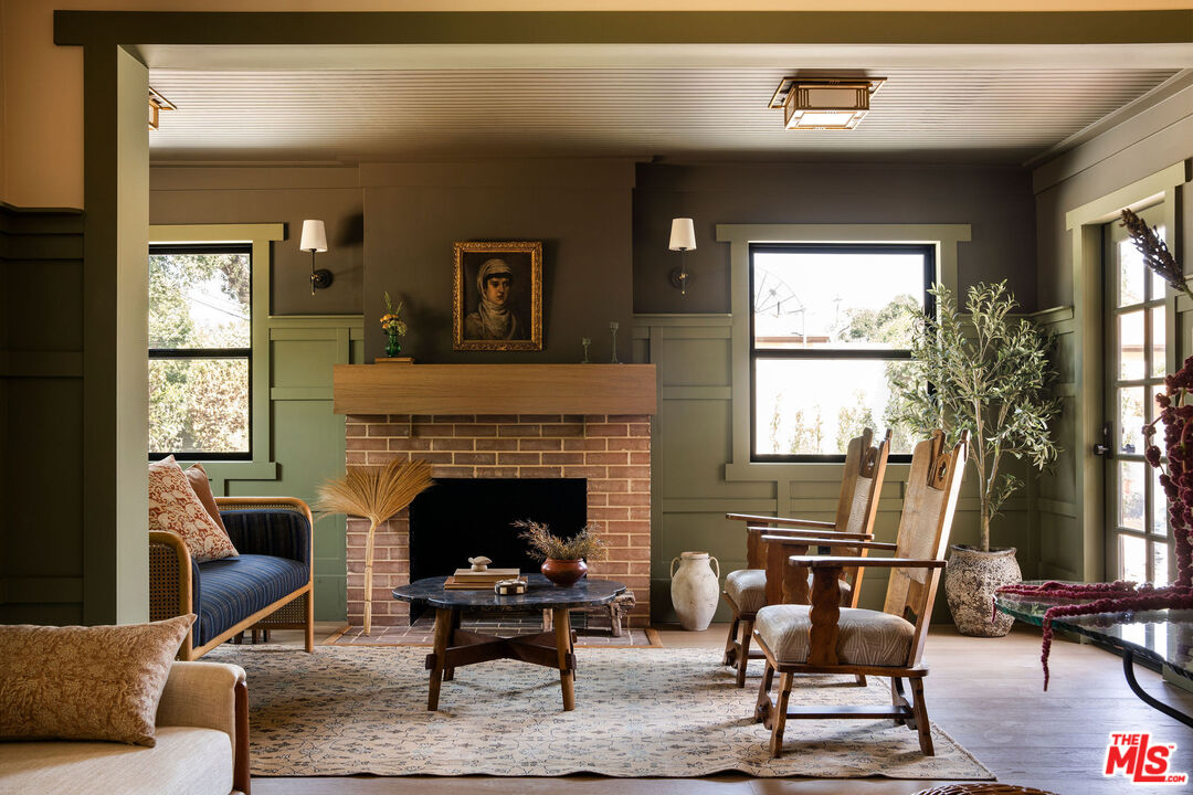 274 Acacia Street Altadena, CA 91001 - Photo 3 of 18 a living room with furniture a fireplace and large windows