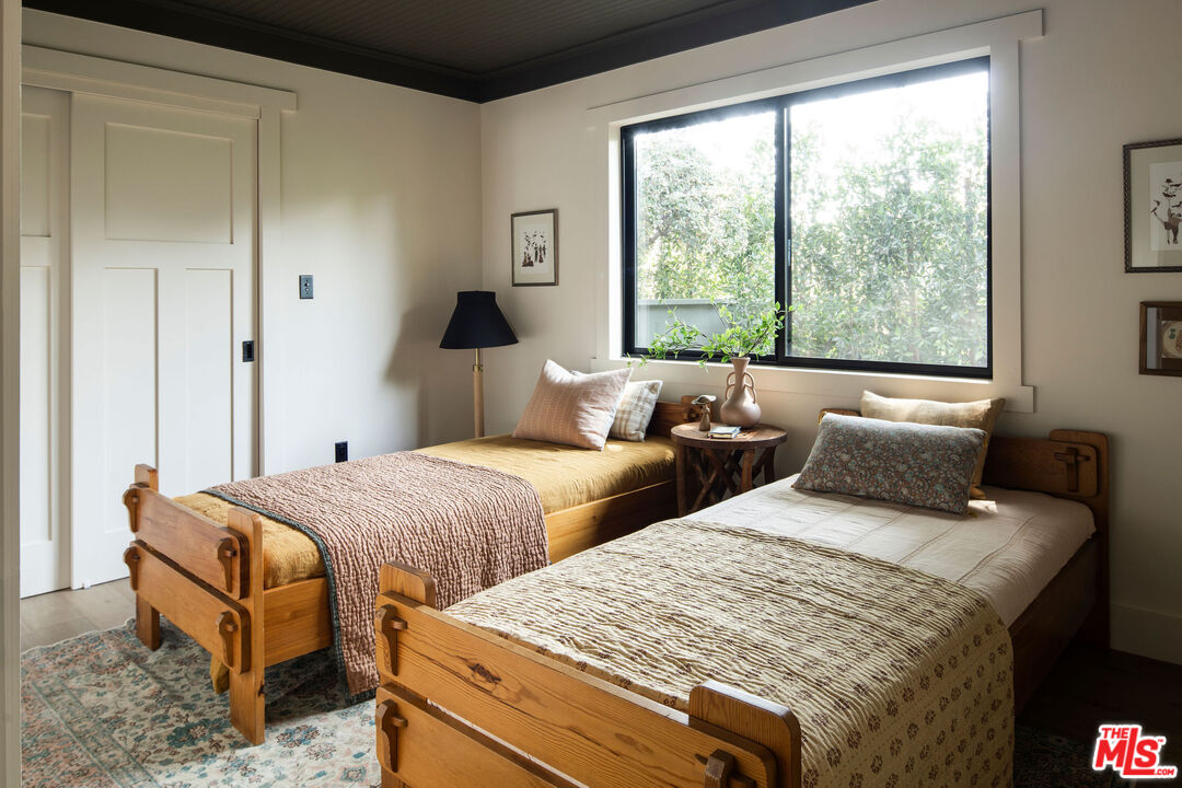 274 Acacia Street Altadena, CA 91001 - Photo 10 of 18 a bedroom with two beds and large windows