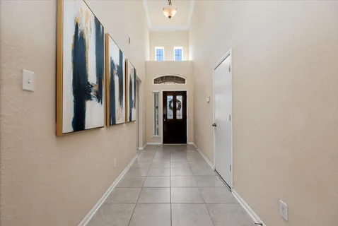 a view of a hallway with entryway door with entryway