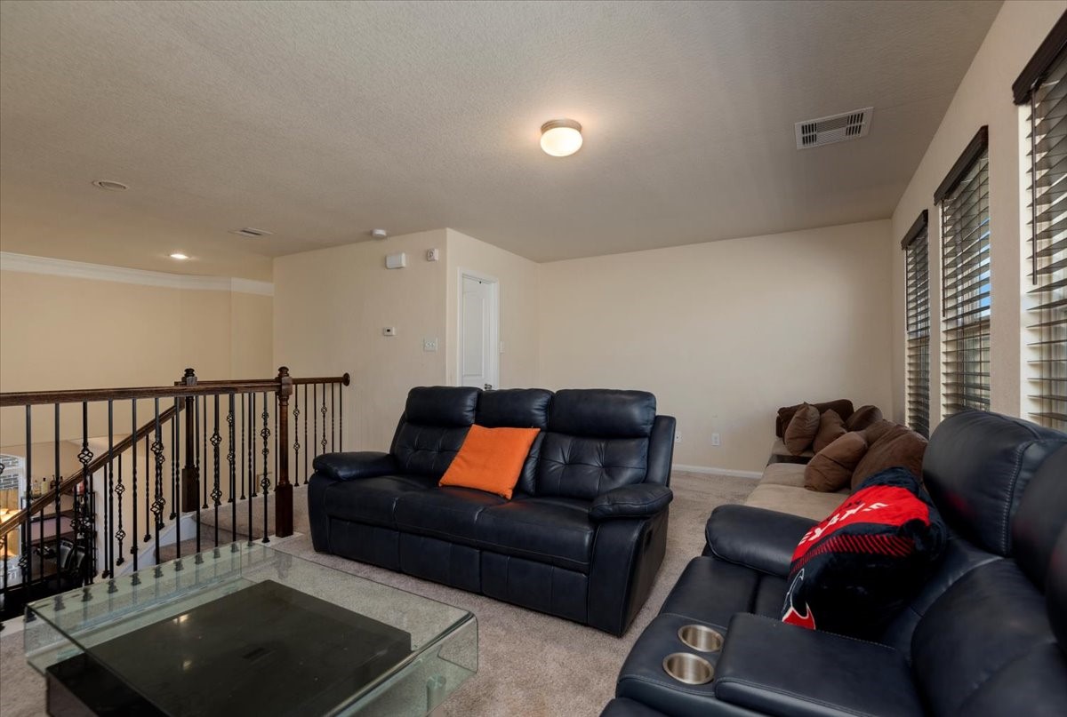 4606 Clara Rose Lane Katy, TX 77449 - Photo 21 of 25 a living room with furniture and a couch