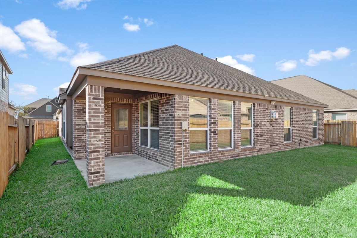 4606 Clara Rose Lane Katy, TX 77449 - Photo 22 of 25 a front view of a house with a yard