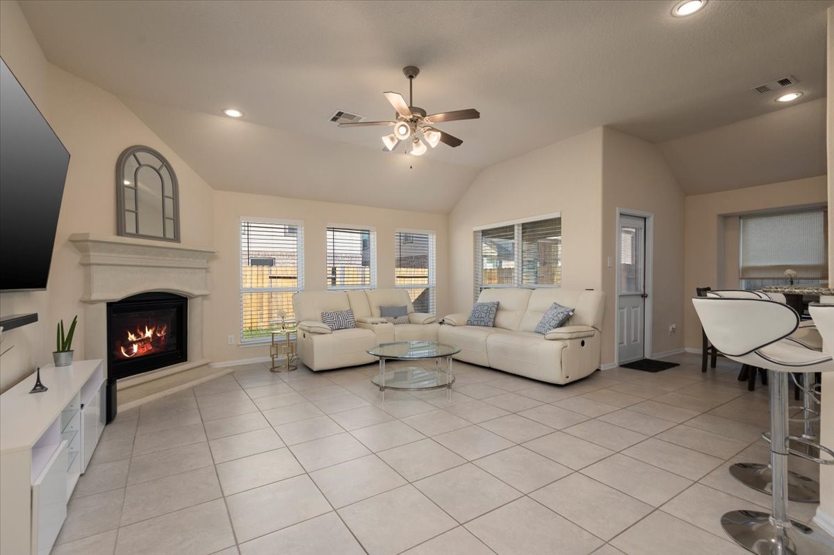 4606 Clara Rose Lane Katy, TX 77449 - Photo 3 of 25 a living room with furniture and a fireplace