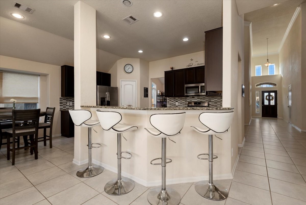 4606 Clara Rose Lane Katy, TX 77449 - Photo 5 of 25 a view of a dining room with furniture