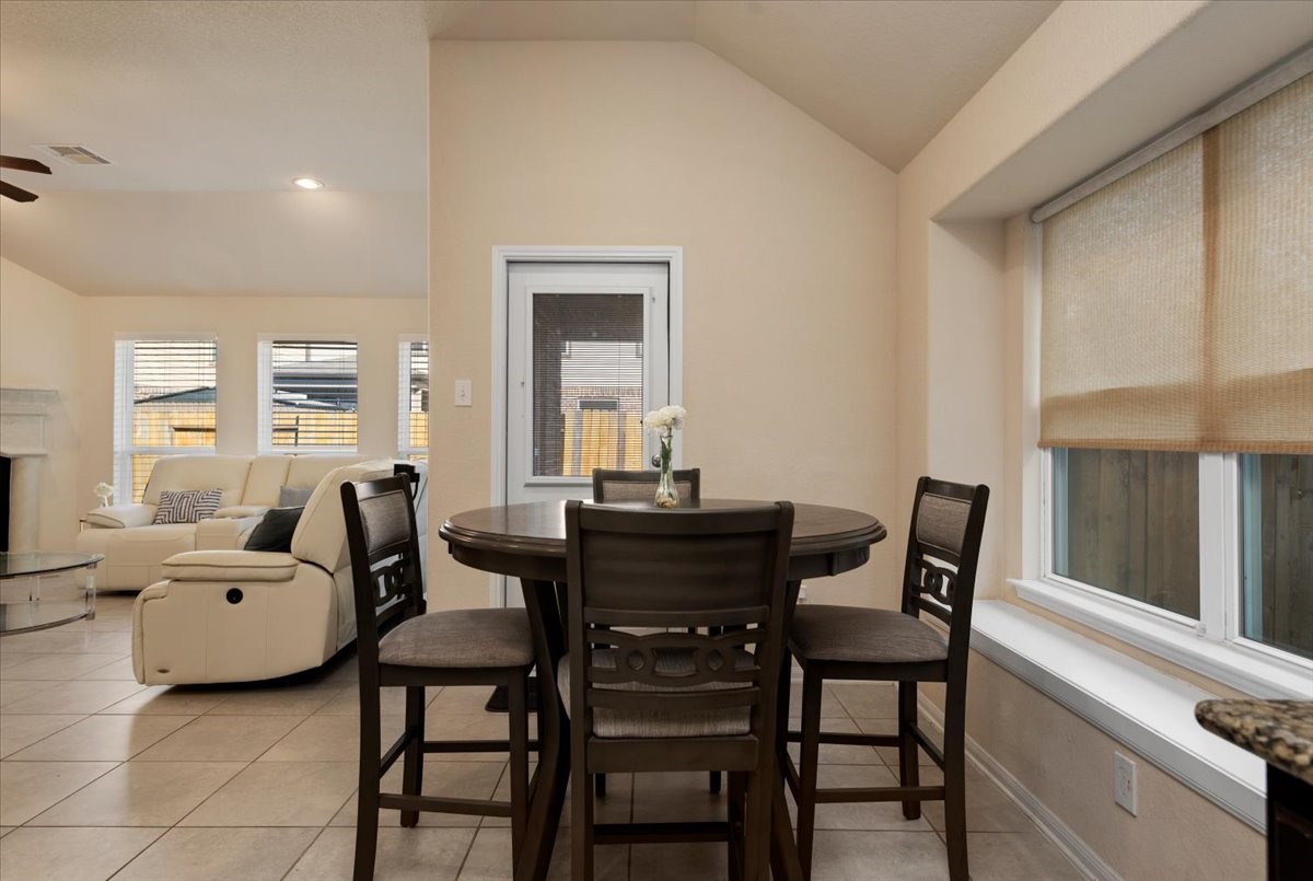 4606 Clara Rose Lane Katy, TX 77449 - Photo 9 of 25 a view of a dining room with furniture and window