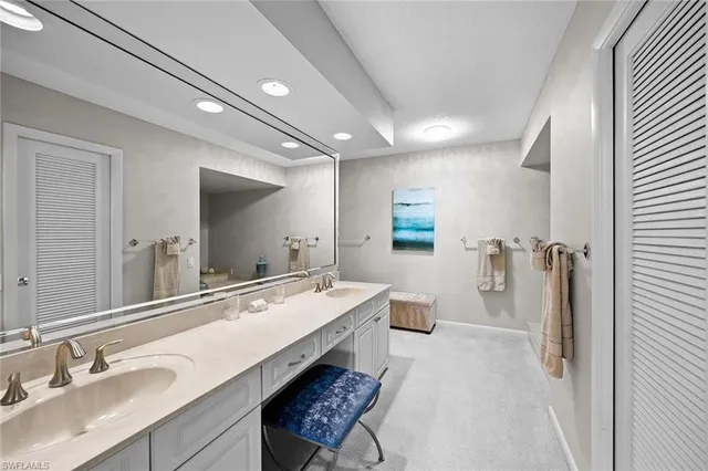 a bathroom with a shower sink and mirror