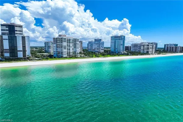 a view of a city with tall buildings and a big yard