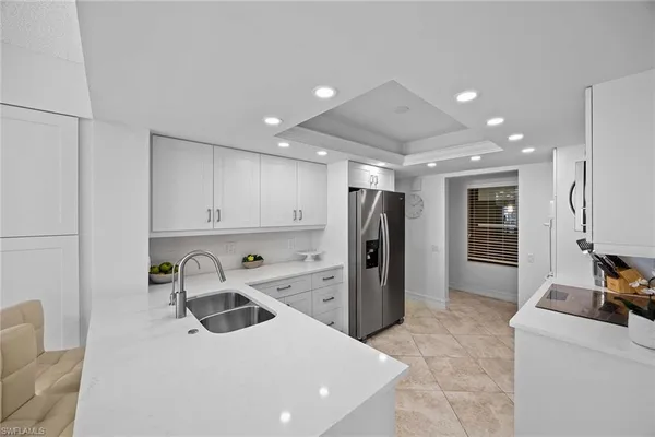 a living room with furniture tv and a large window