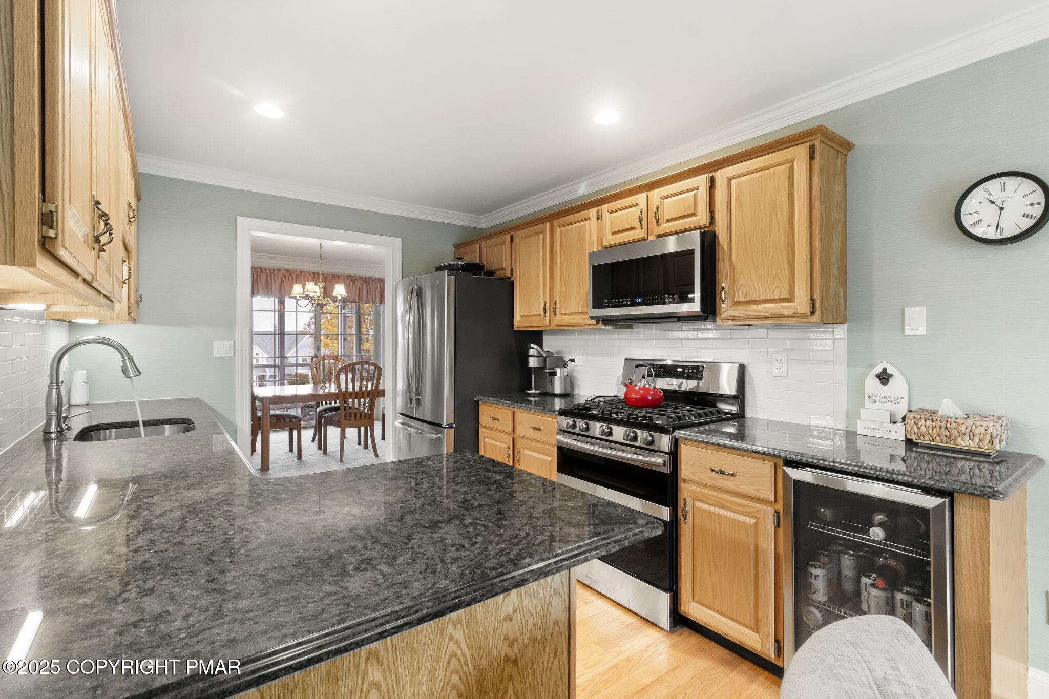 7317 Meadow Lane Canadensis, PA 18325 - Photo 11 of 25 a kitchen with a stove a sink and a microwave