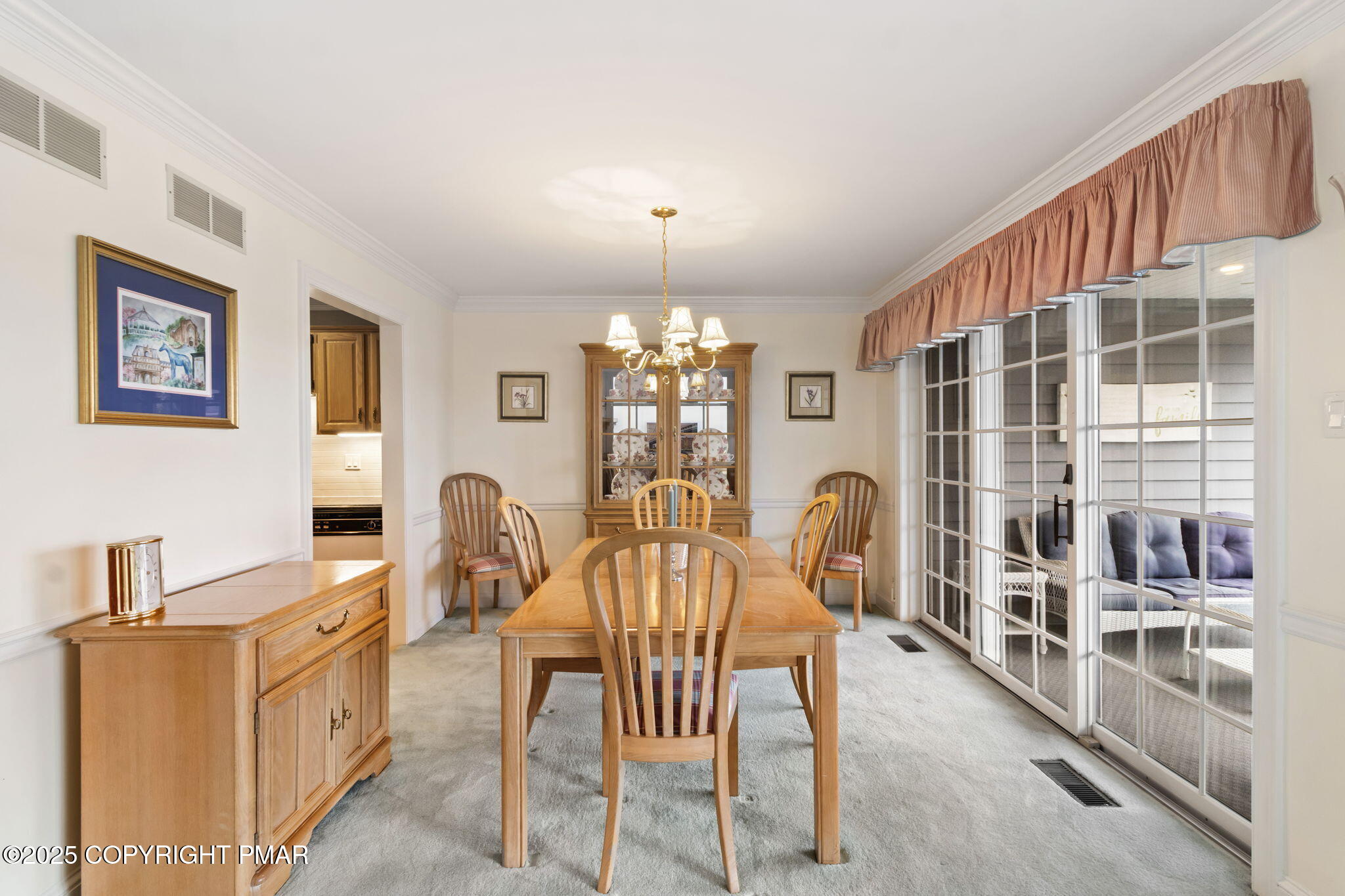 7317 Meadow Lane Canadensis, PA 18325 - Photo 14 of 25 a view of a dining room with furniture and chandelier