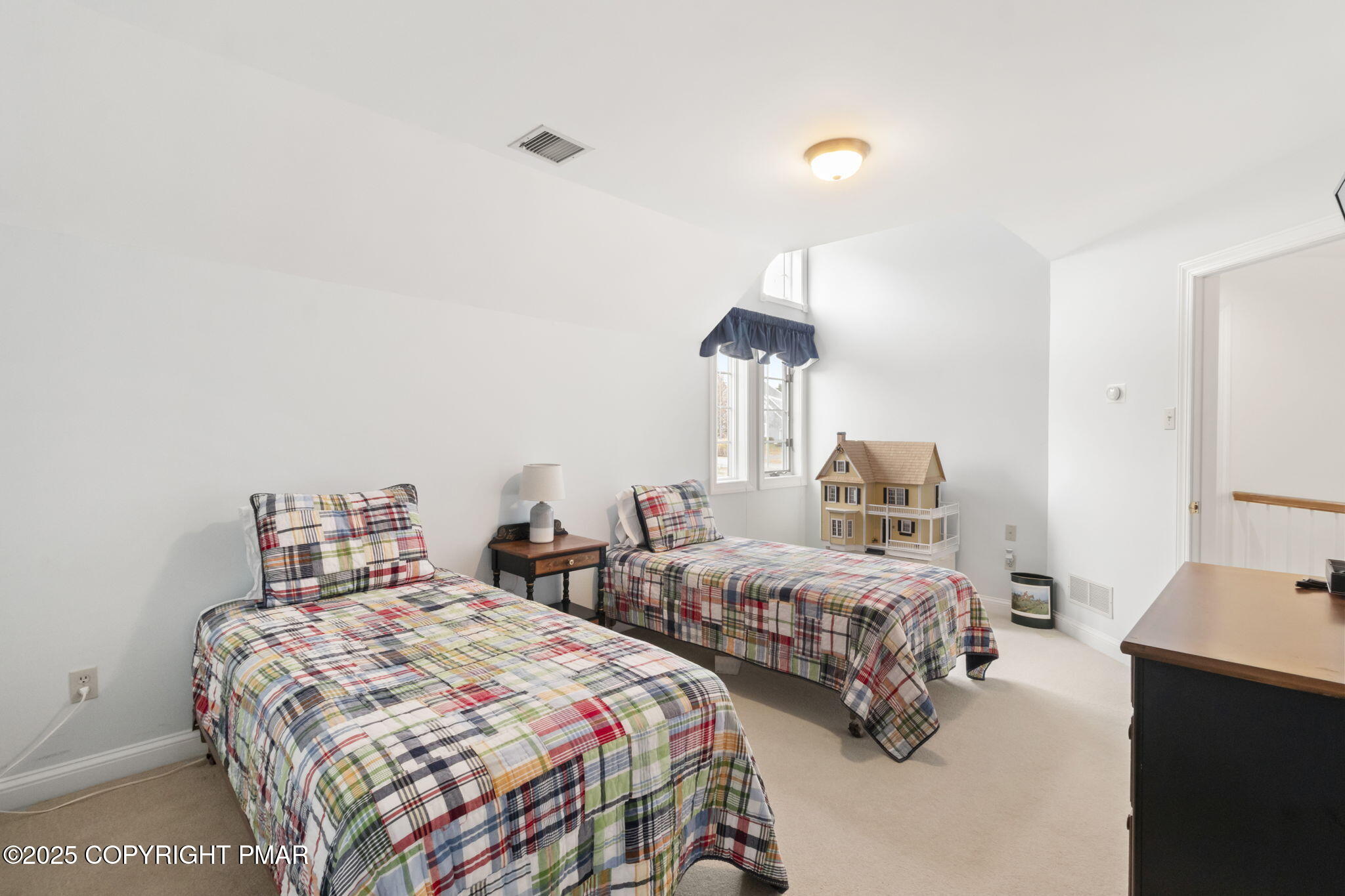 7317 Meadow Lane Canadensis, PA 18325 - Photo 23 of 25 a bedroom with two beds and a chandelier