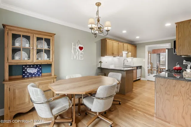 a kitchen with a stove a sink and a microwave