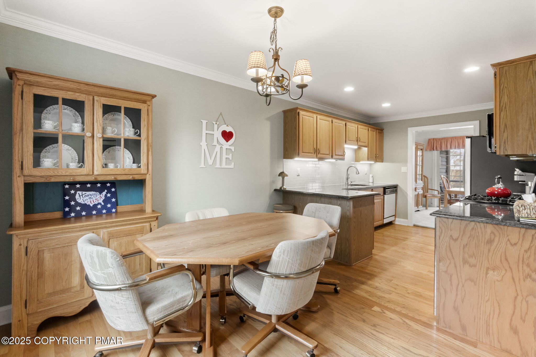 7317 Meadow Lane Canadensis, PA 18325 - Photo 10 of 25 a view of a dining room with furniture a chandelier and wooden floor