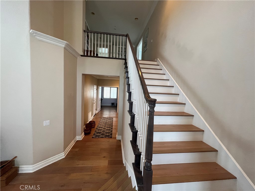 2420 Via Mero San Clemente, CA 92673 - Photo 5 of 7 a view of staircase with wooden floor and white walls