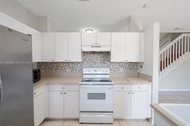 a bathroom with a bathtub a sink and a mirror