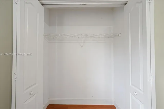 an aerial view of a house with a garden and lake view