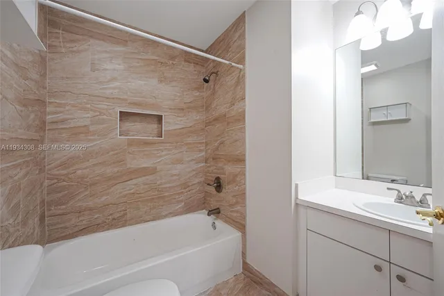 an aerial view of a house with garden space and street view