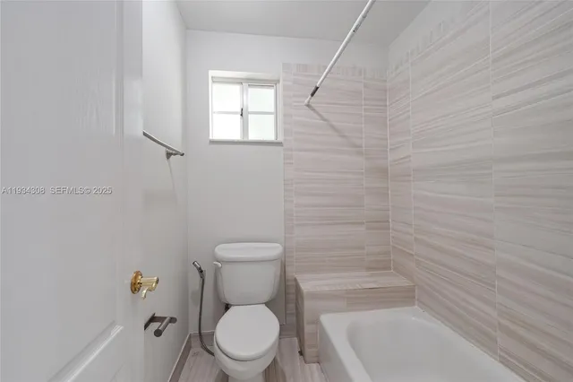 an aerial view of residential building with green space