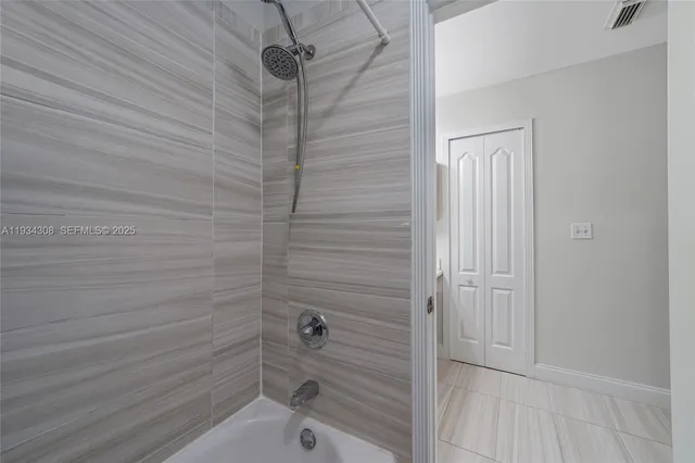 an aerial view of a city with lots of residential buildings ocean and ocean view