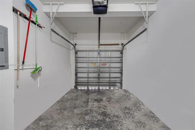 a view of backyard with wooden fence and large trees