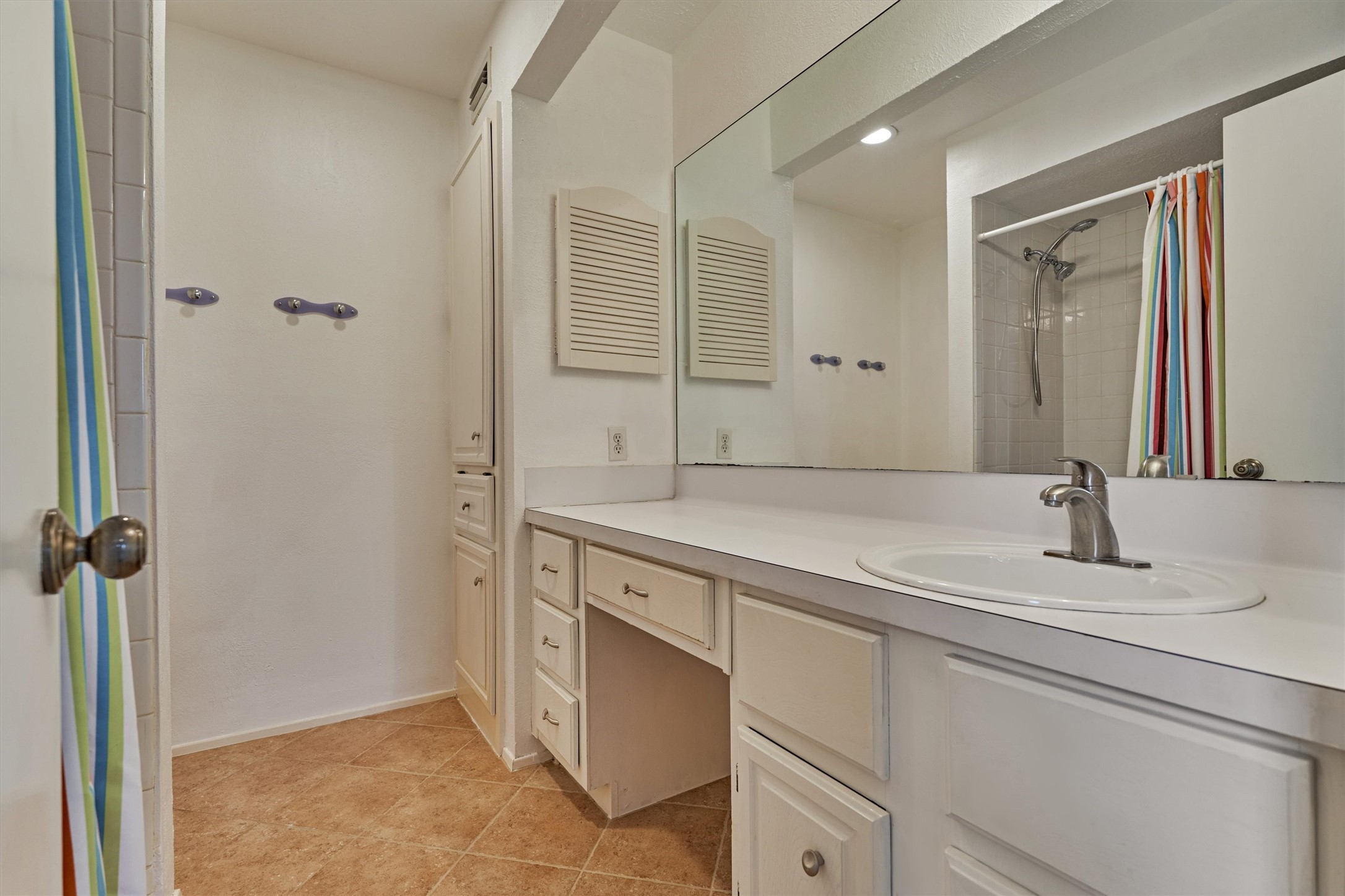 1427 Bowsprit Point Willis, TX 77318 - Photo 31 of 47 The ensuite bath has great counter space, a vanity area, built-in storage and a laundry hamper.