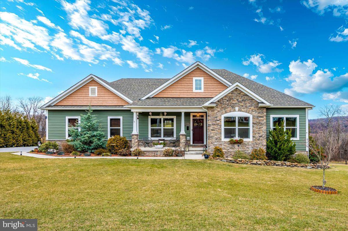 a front view of house with yard outdoor seating and barbeque oven