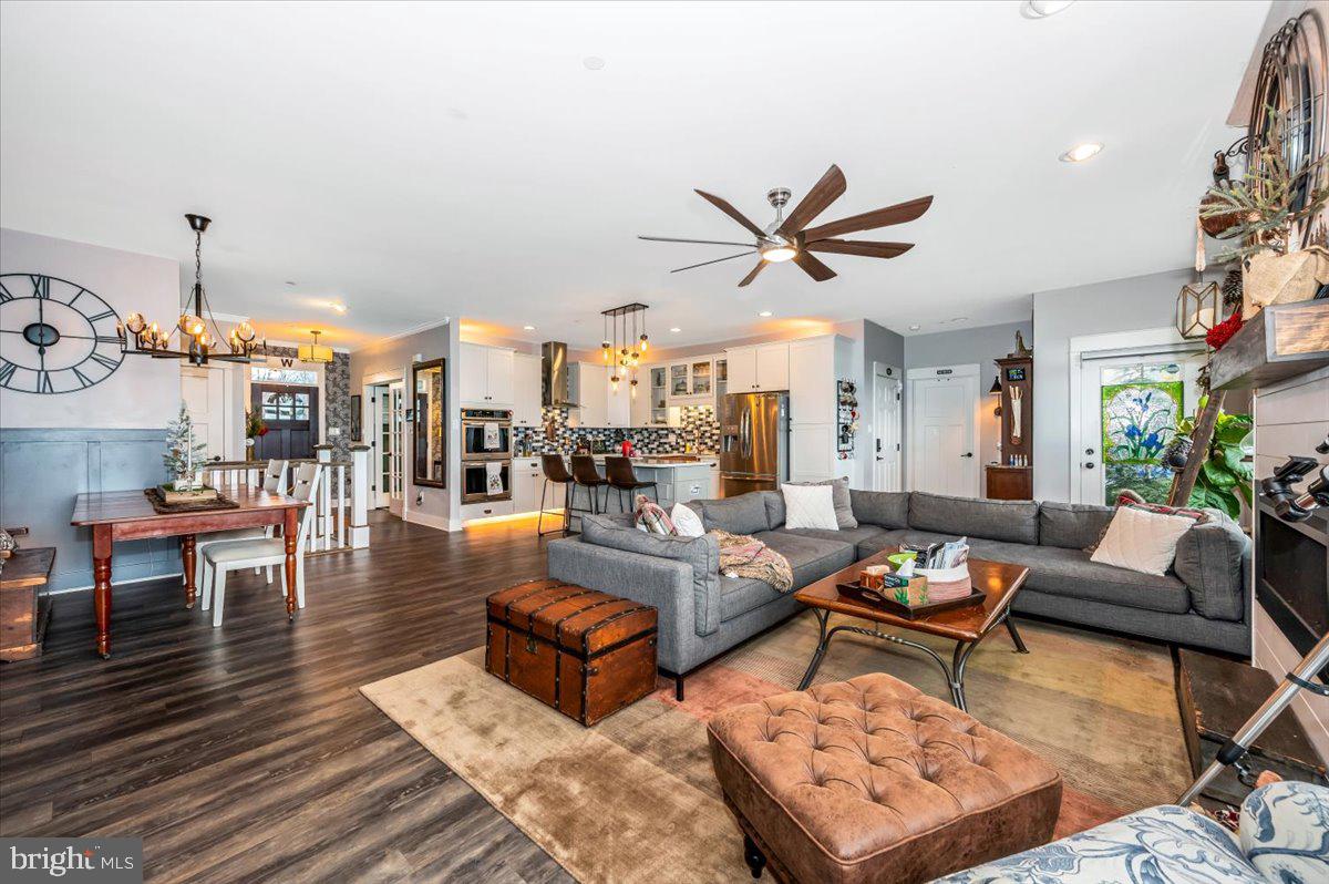 14231 Ridenour Road Smithsburg, MD 21783 - Photo 13 of 76 a living room with furniture a rug and a chandelier