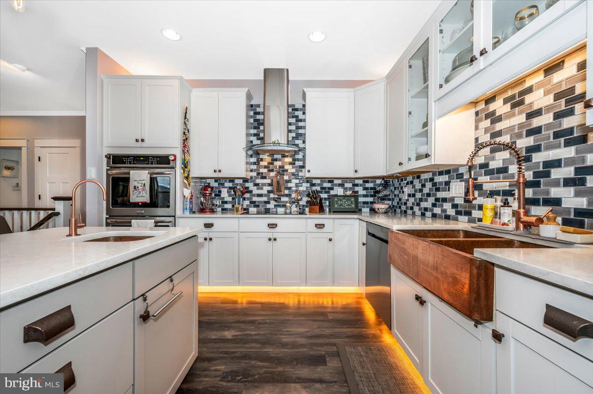 14231 Ridenour Road Smithsburg, MD 21783 - Photo 24 of 76 a kitchen with stainless steel appliances a sink and a stove