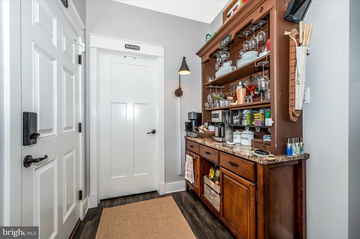 14231 Ridenour Road Smithsburg, MD 21783 - Photo 25 of 76 a kitchen with stainless steel appliances granite countertop a refrigerator and a stove