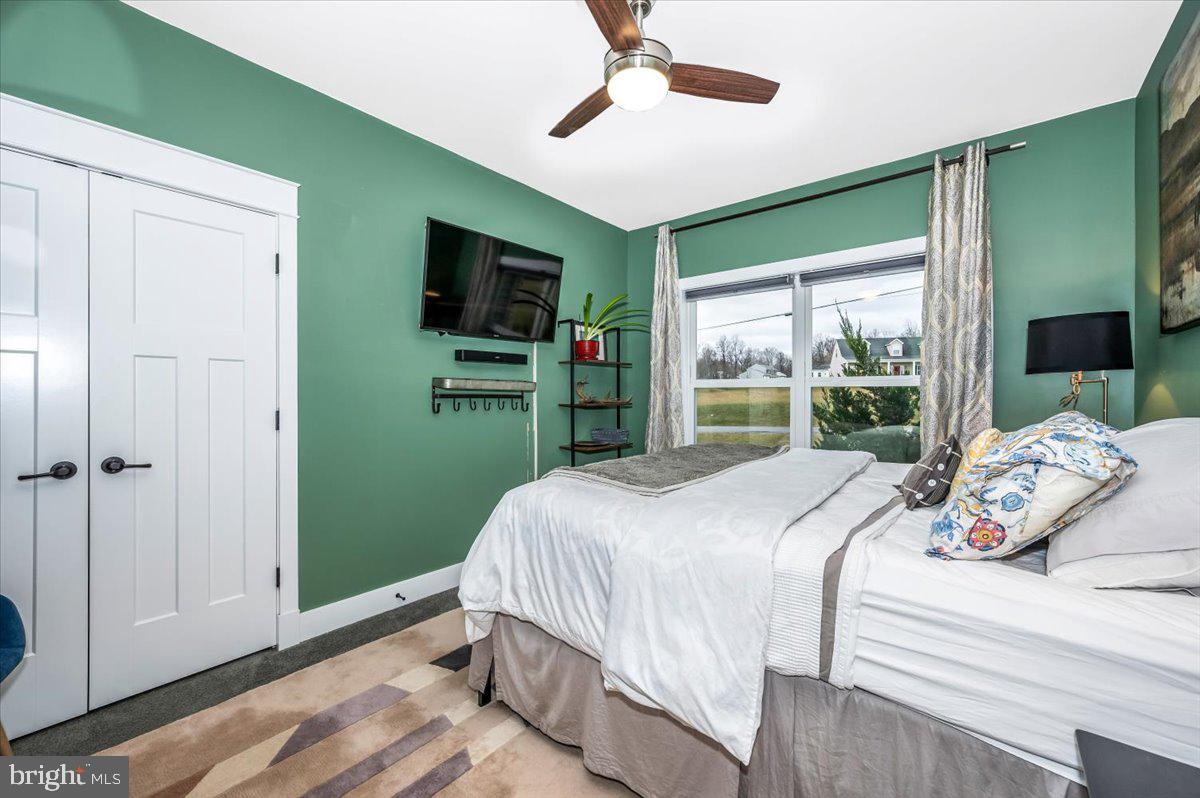 14231 Ridenour Road Smithsburg, MD 21783 - Photo 39 of 76 a bedroom with a large bed and a window