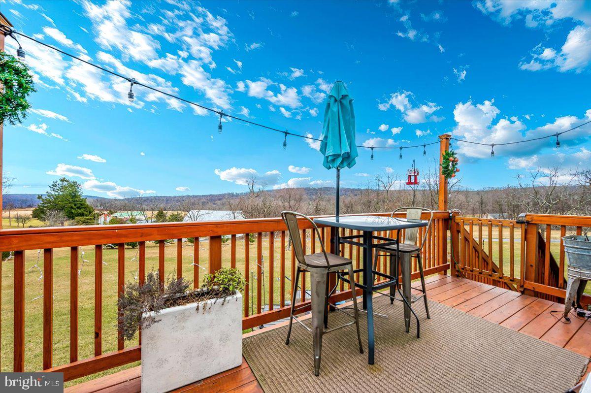 14231 Ridenour Road Smithsburg, MD 21783 - Photo 57 of 76 a view of a chairs and tables in the patio