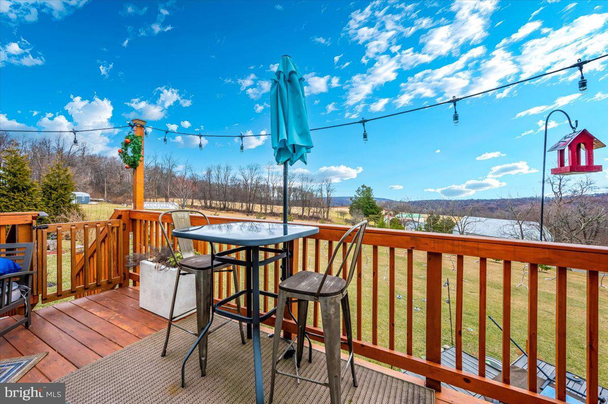 14231 Ridenour Road Smithsburg, MD 21783 - Photo 58 of 76 a view of chairs and tables in a patio